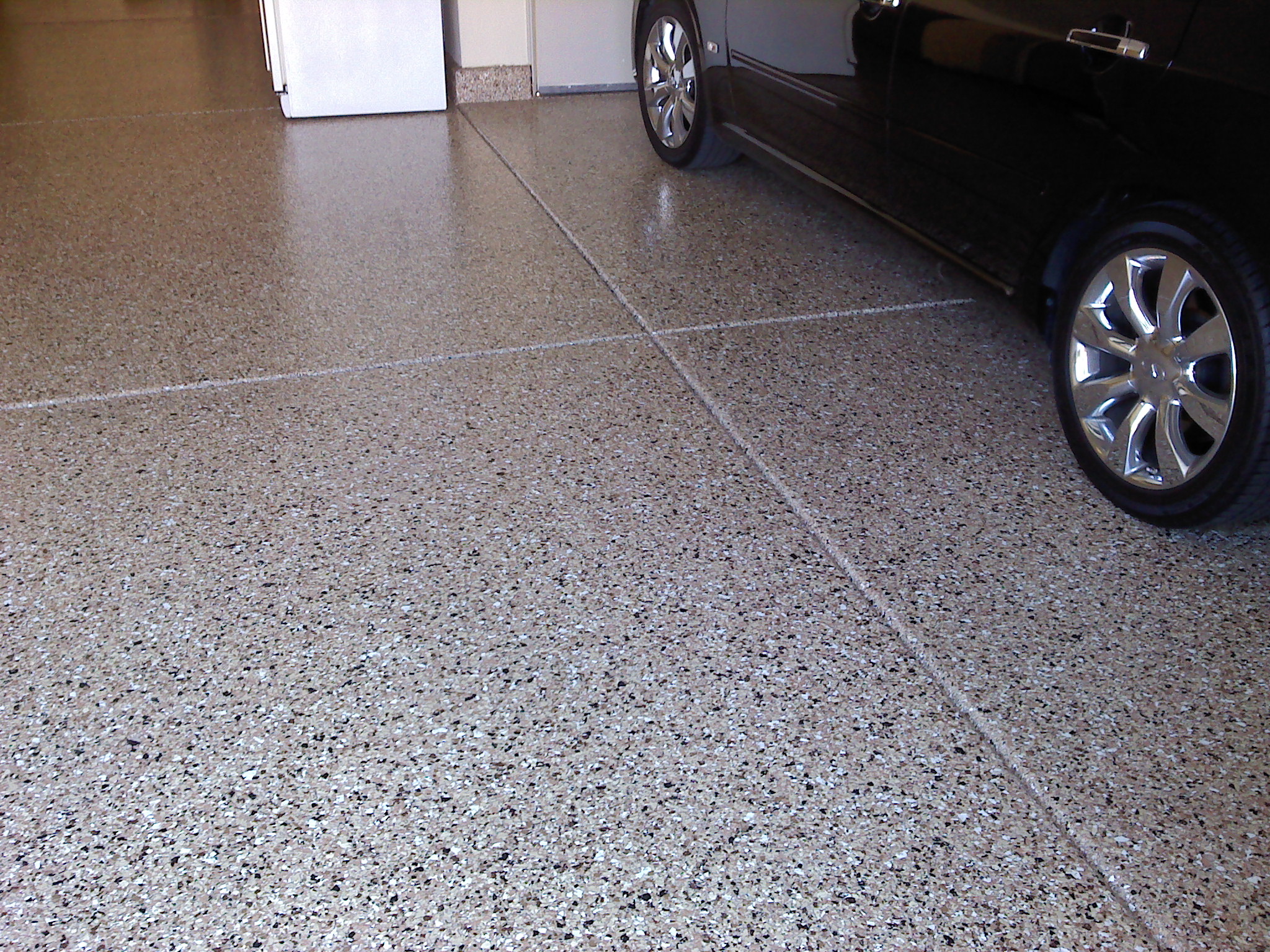 Revamp Your Garage: Exploring the Benefits of Garage Floor Tiles and Epoxy Coatings
